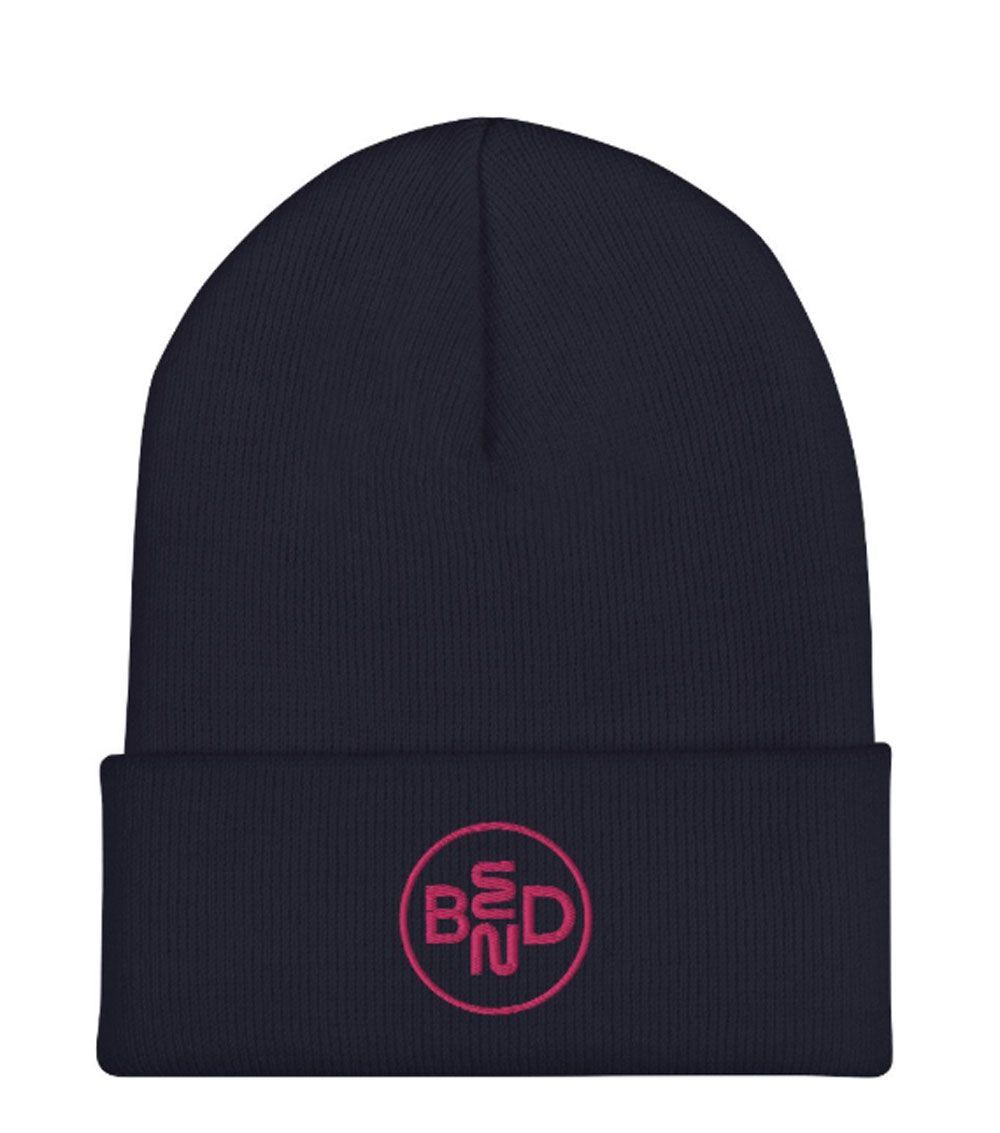 A white cup with a green bed logo on it