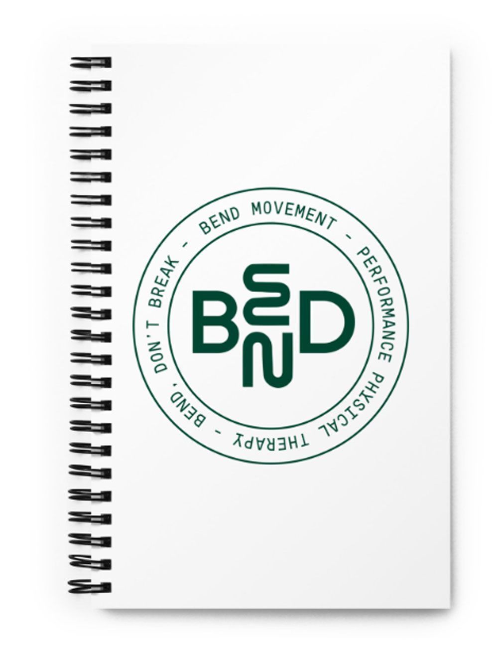 A spiral notebook with the word bed on it