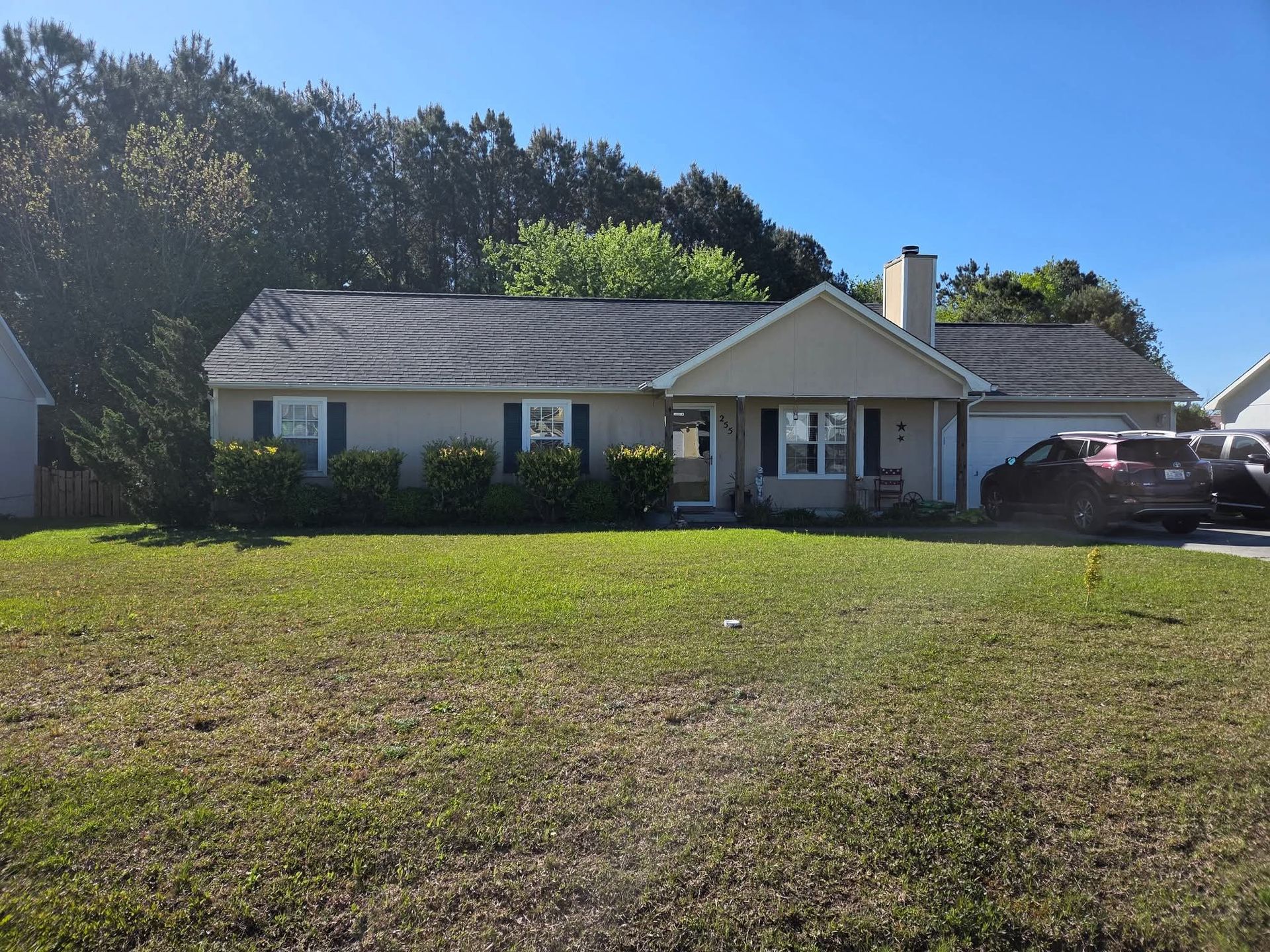 A house with a lot of grass in front of it