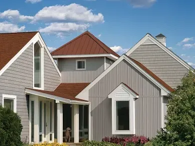 A house with a red roof and white trim