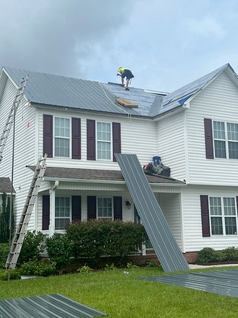 A Man Working on The Roof — Jacksonville, NC — JW Roofing & Exteriors