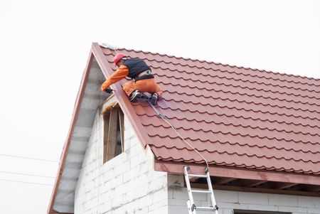 Worker installing a roof