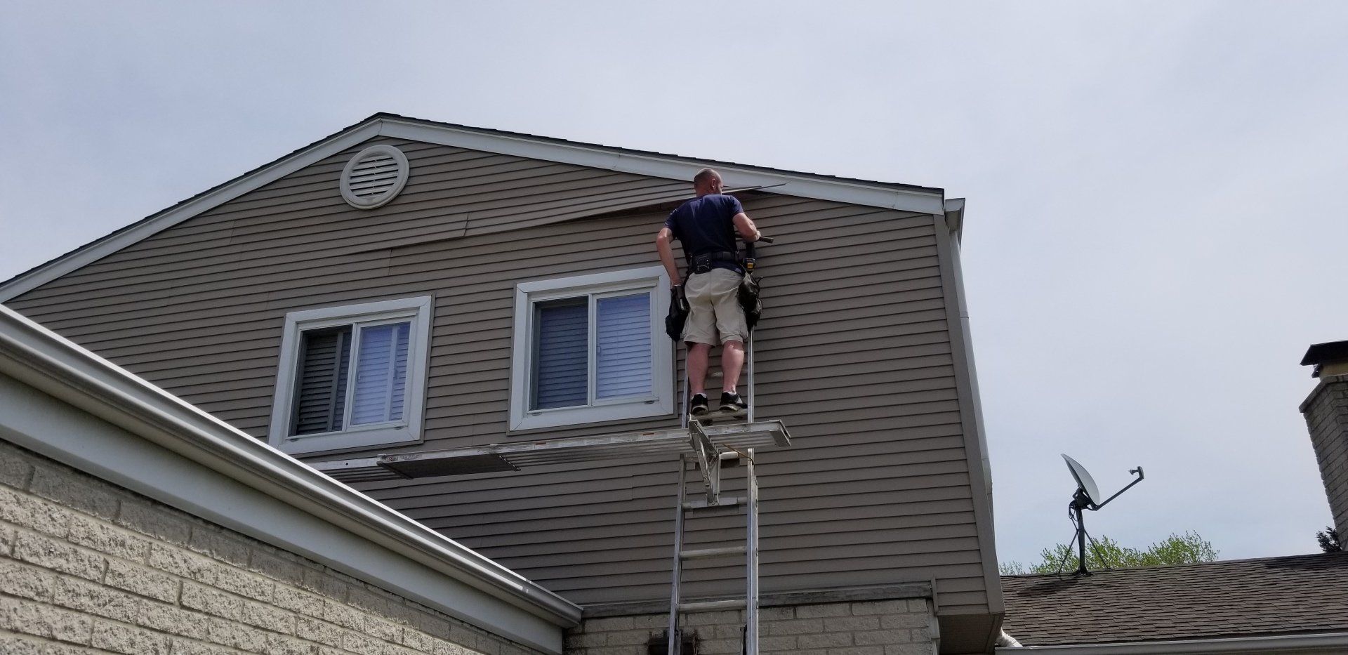 Siding repair on a gable