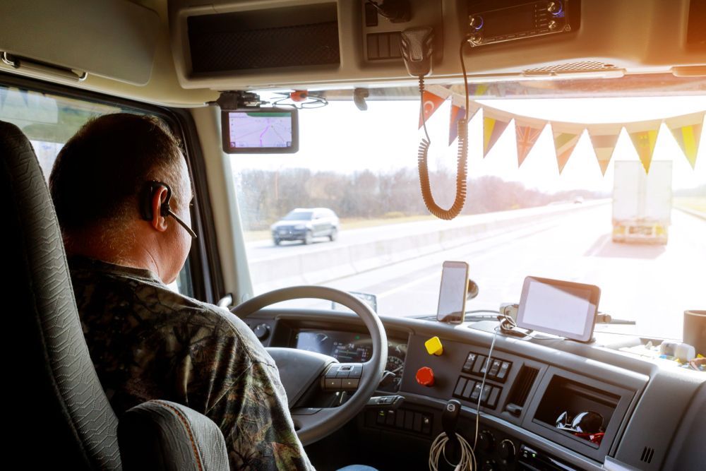 Man driving a commercial vehicle.