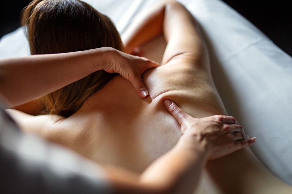 Woman receiving a deep tissue massage.