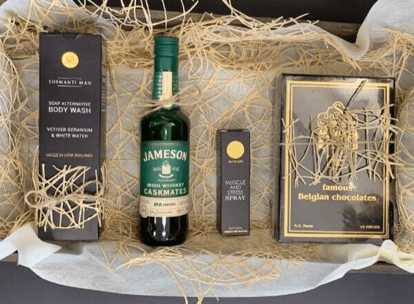 a bottle of jameson whiskey is surrounded by other items