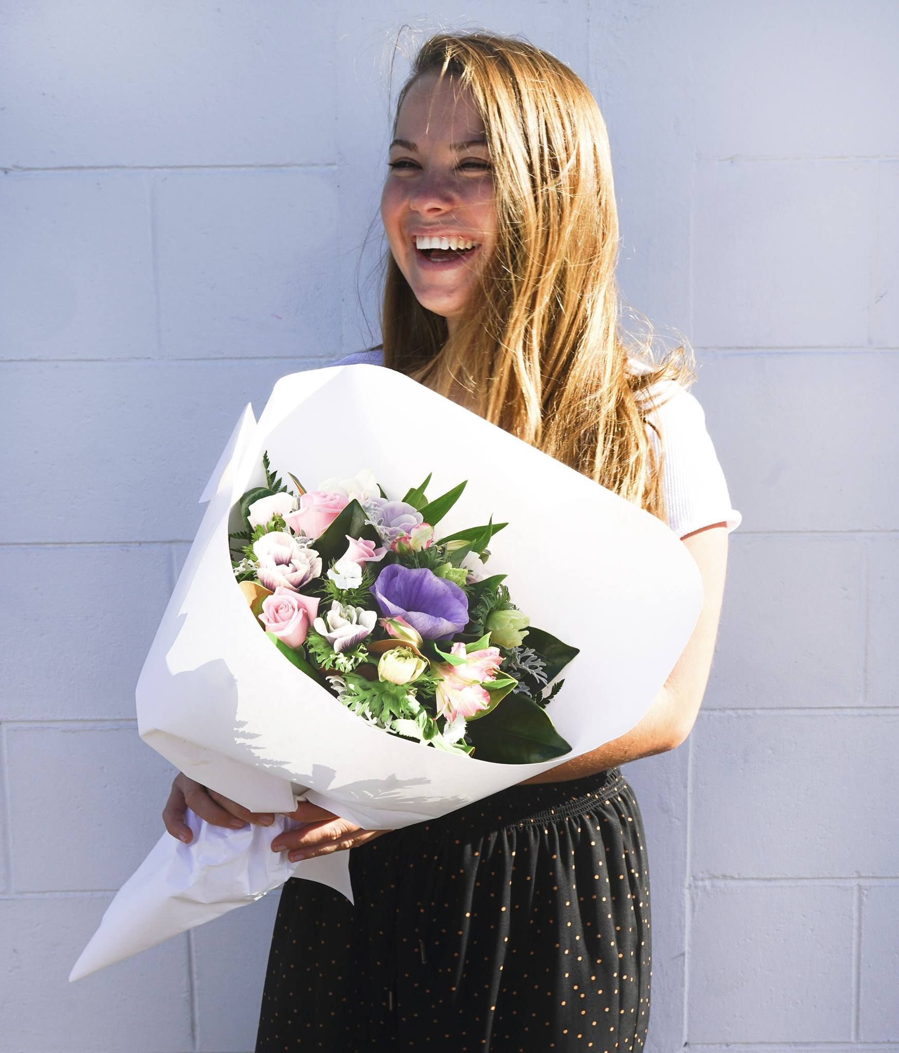 Pretty girl with a beautiful bouquet of flowers from Court Florist Christchurch