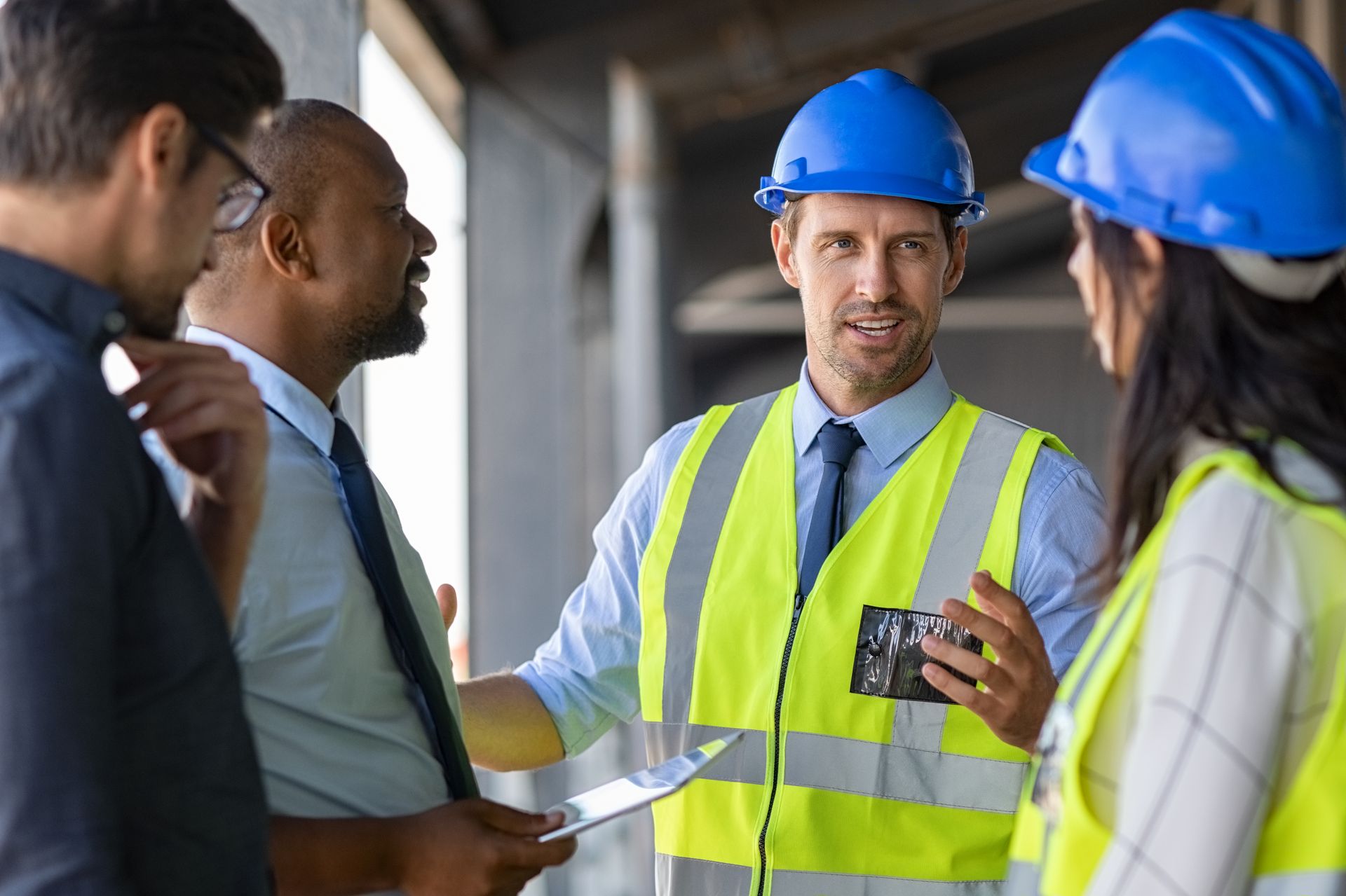 Construction workers in hard hats and vests
