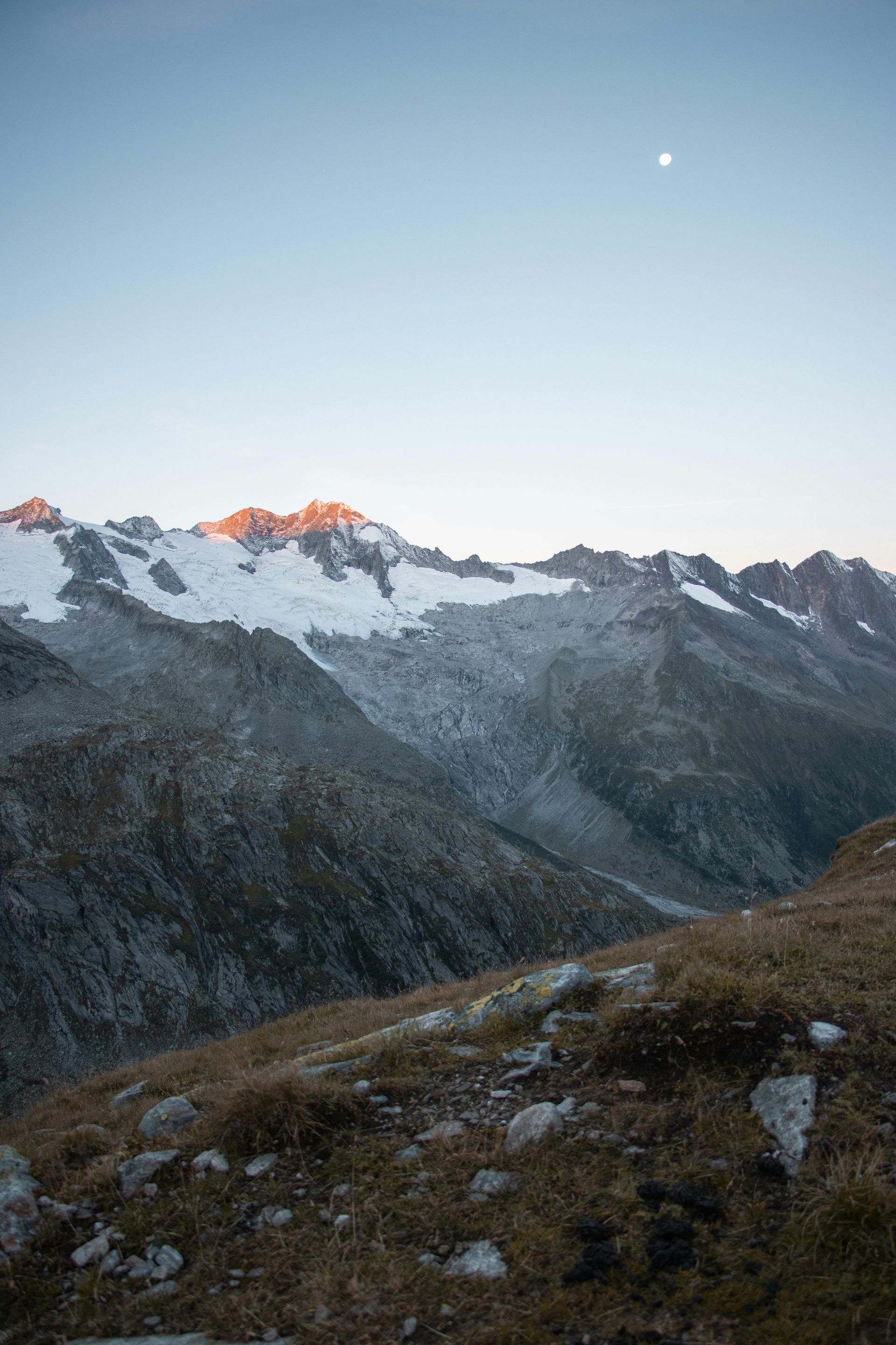 Greg in the Wilderness: “Greg McHale trekking through the rugged Yukon wilderness, surrounded by towering mountains and dense forests on a mission to explore untouched terrain.”
