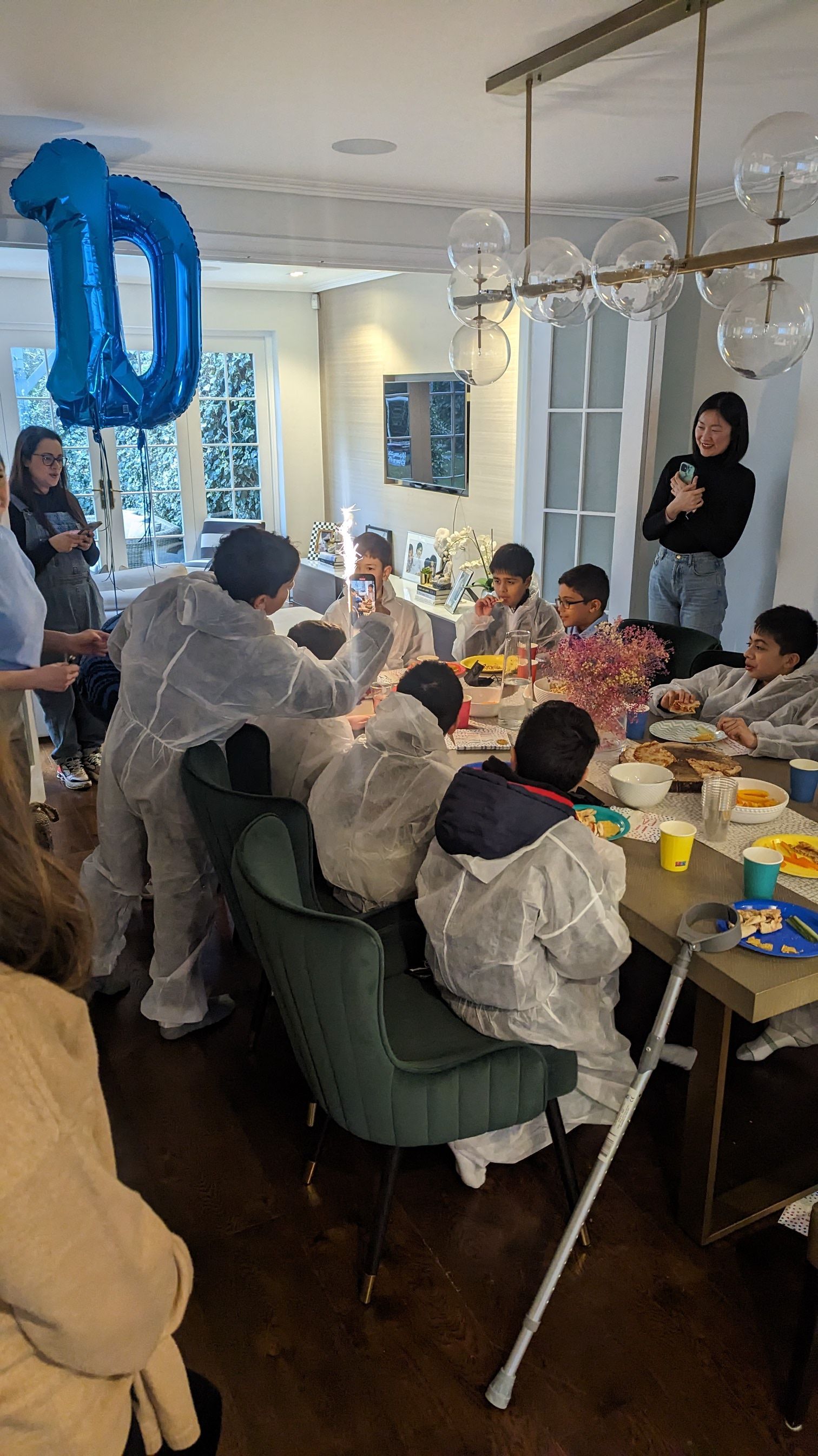 Graffiti birthday board signed by party guests with individual spray-painted boards created by each child at a Street Stars graffiti party.