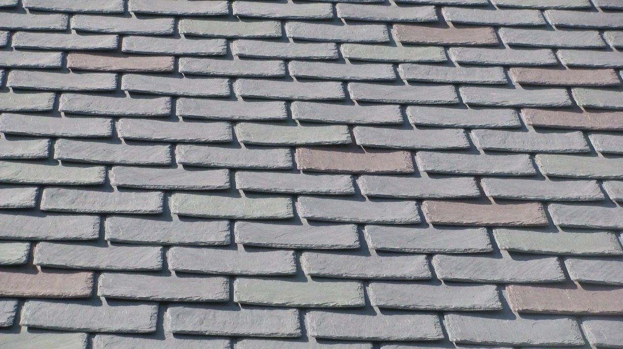 A close up of a brick floor with a diagonal pattern