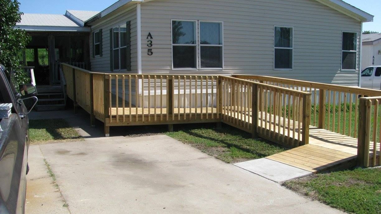 A mobile home with a ramp in front of it