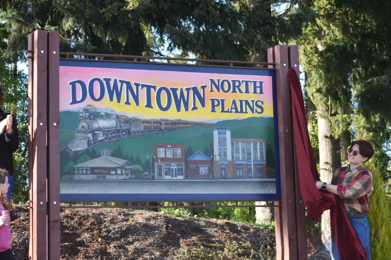 A sign that says downtown north plains on it