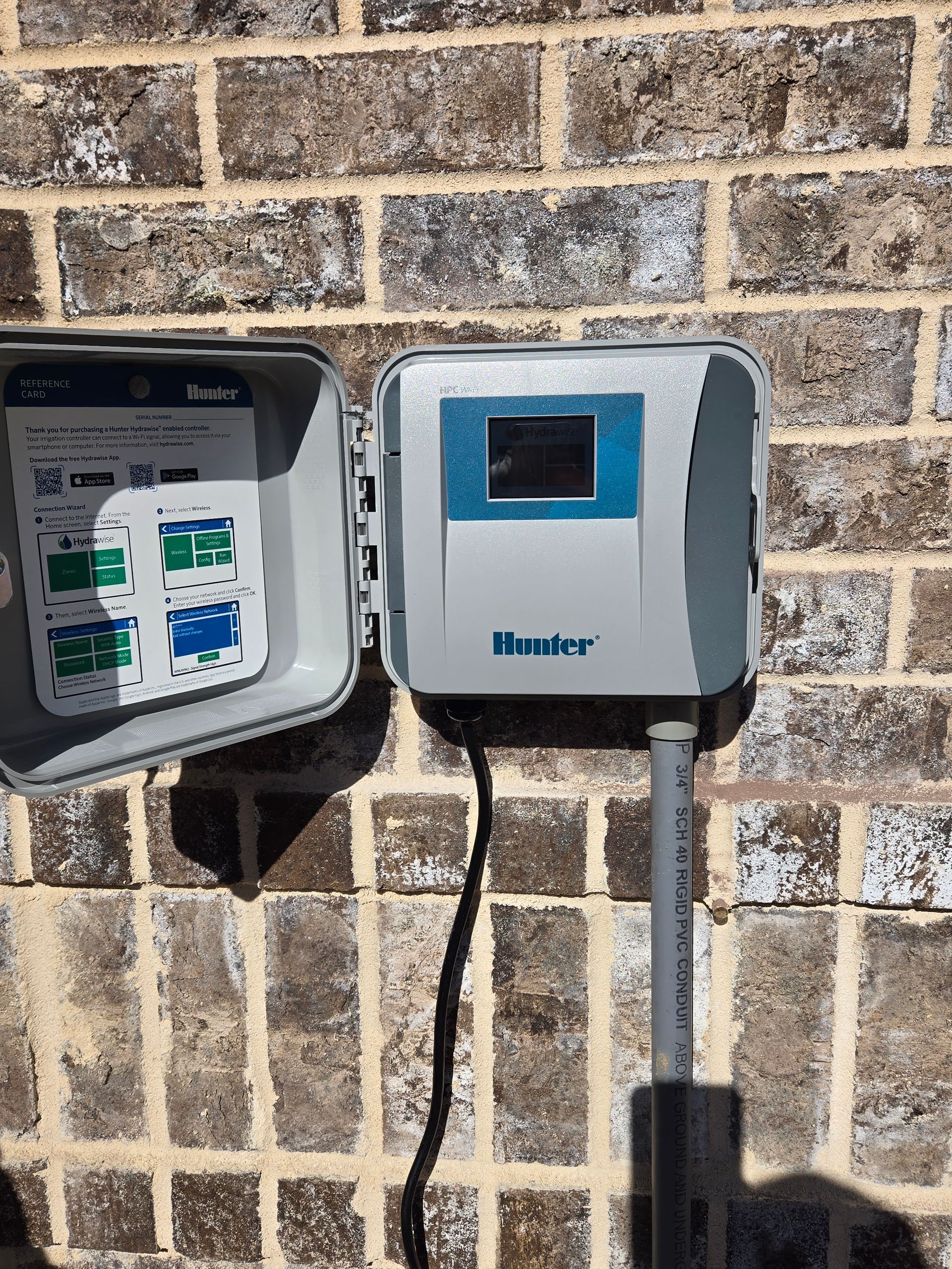 A hunter box is mounted to a brick wall