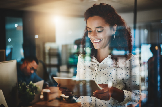 smiling woman on tablet