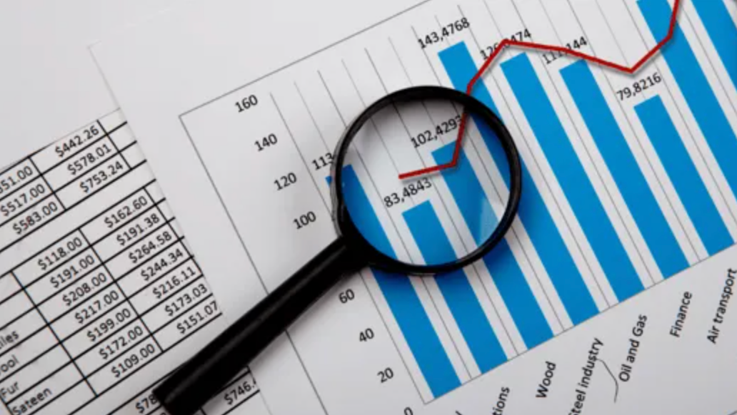 A magnifying glass is sitting on top of a graph.