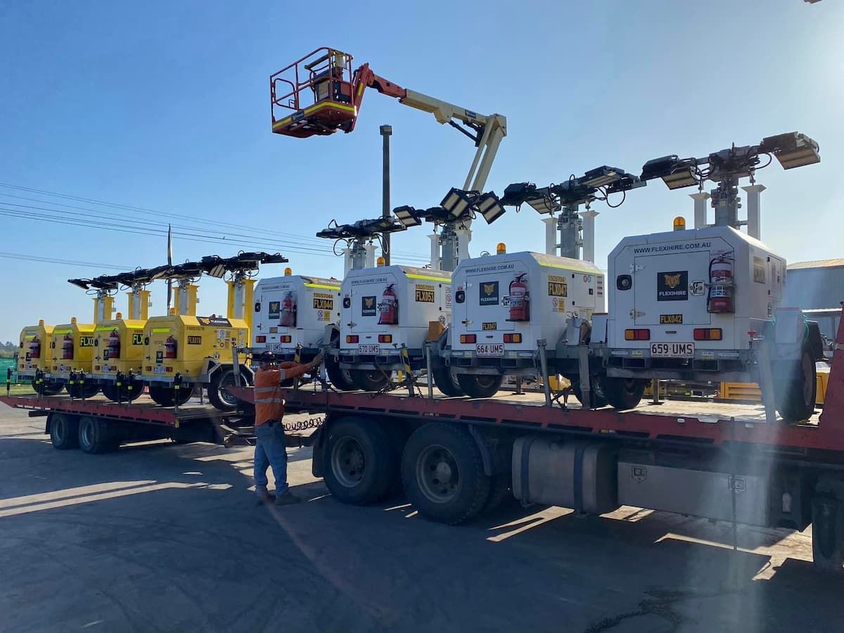 Heavy Machinery on a Transfer Truck — Offset Tilt Trays In Biloela, QLD