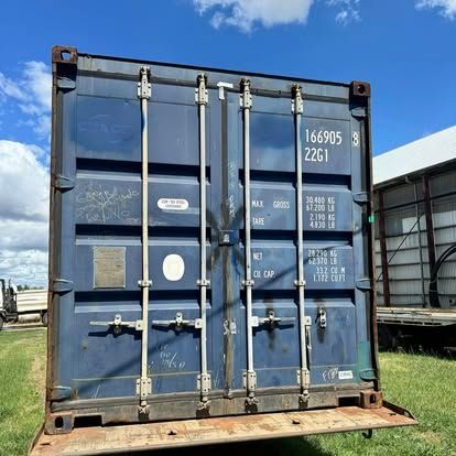 A Semi Truck With A Blue Container On The Back — Offset Tilt Trays In Biloela, QLD