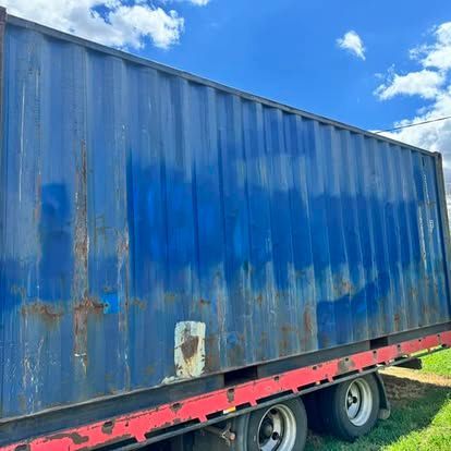 A Semi Truck With A Blue Container On The Back — Offset Tilt Trays In Biloela, QLD