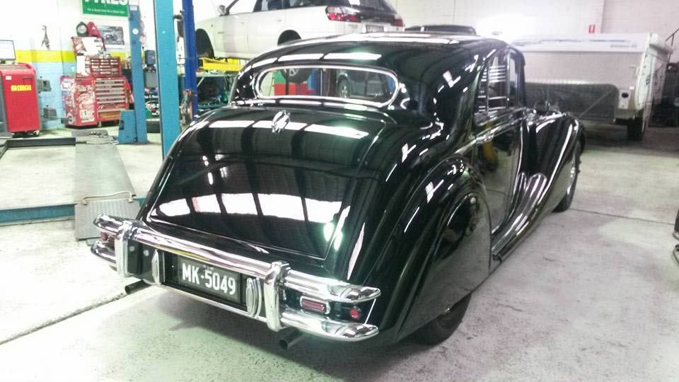 Back view of the shiny black car — Narrabeen, NSW — British & Swedish Motors