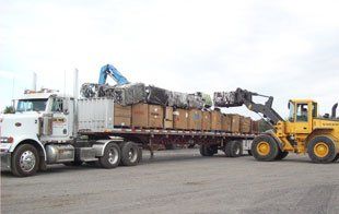 Vehicles Transporting Scrap Metal — Kankakee, IL — Acme Auto Parts