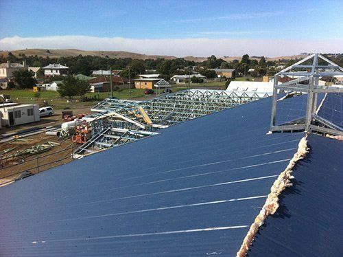 top of metal roof overlooking construction