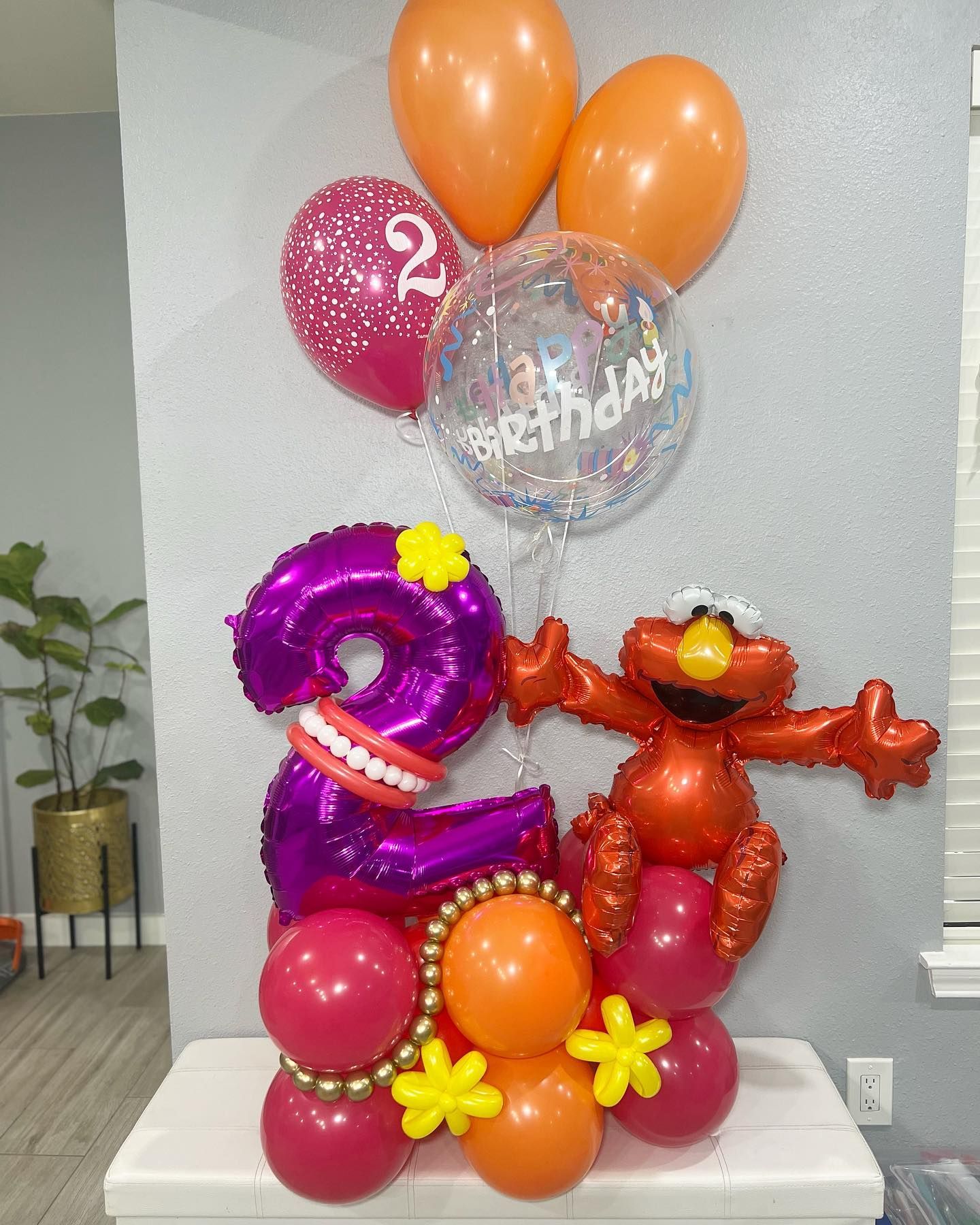 A bunch of balloons are sitting on top of a table.
