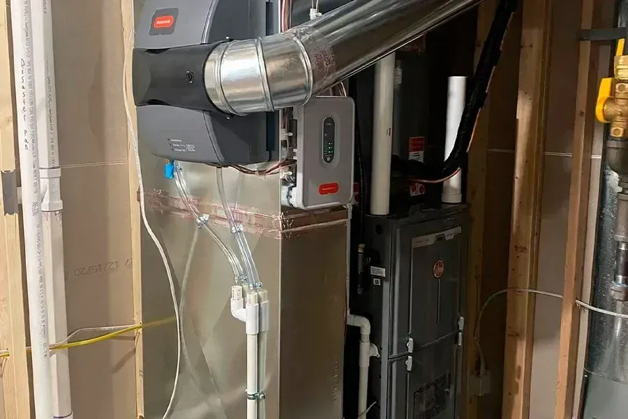 A heating and cooling system is being installed in a basement.