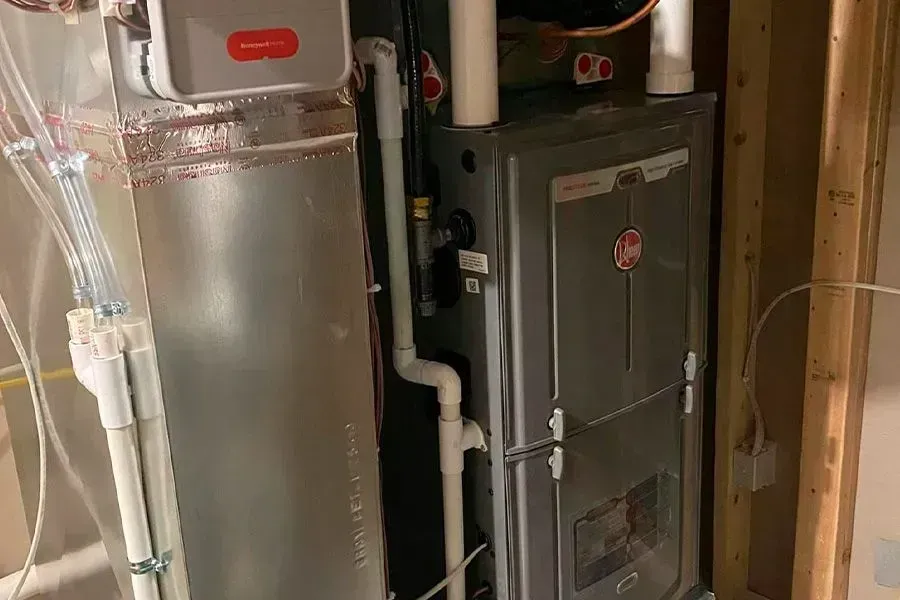 A heating and cooling system is being installed in a basement.