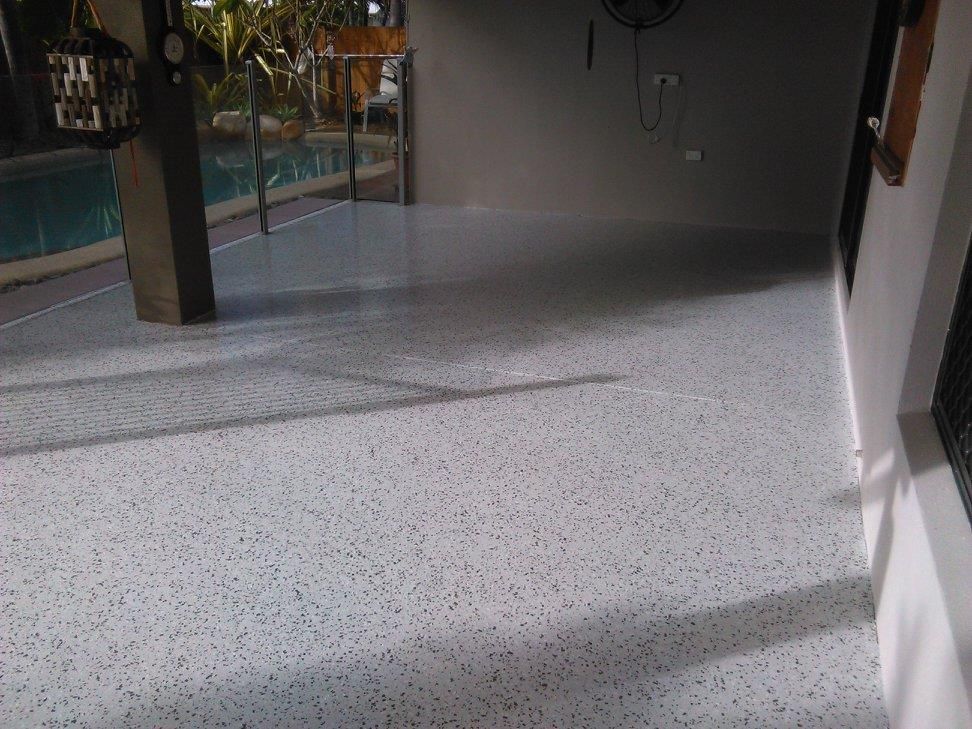 White Concrete Floor in a Room Next to a Pool — Australian Epoxy Floors in Rockhampton, QLD