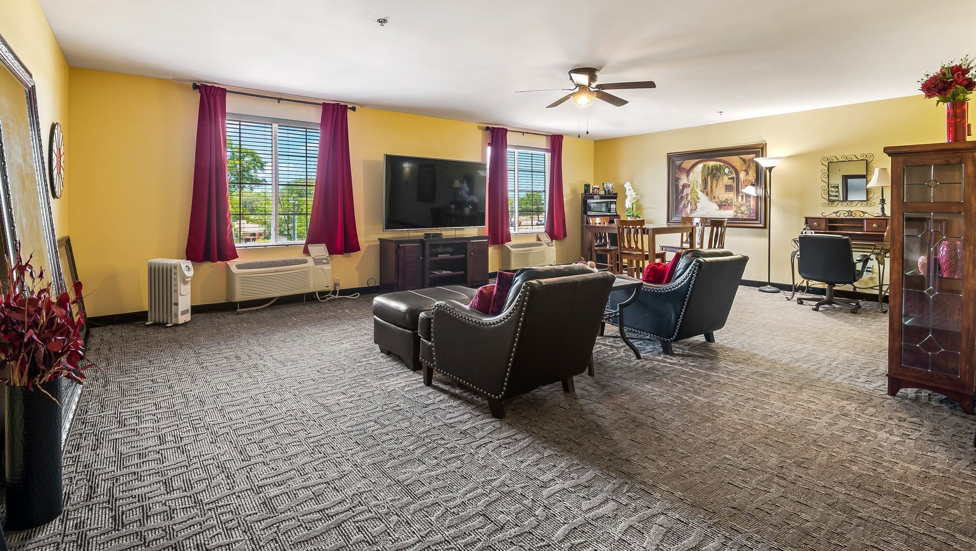 A living room filled with furniture and a flat screen tv.