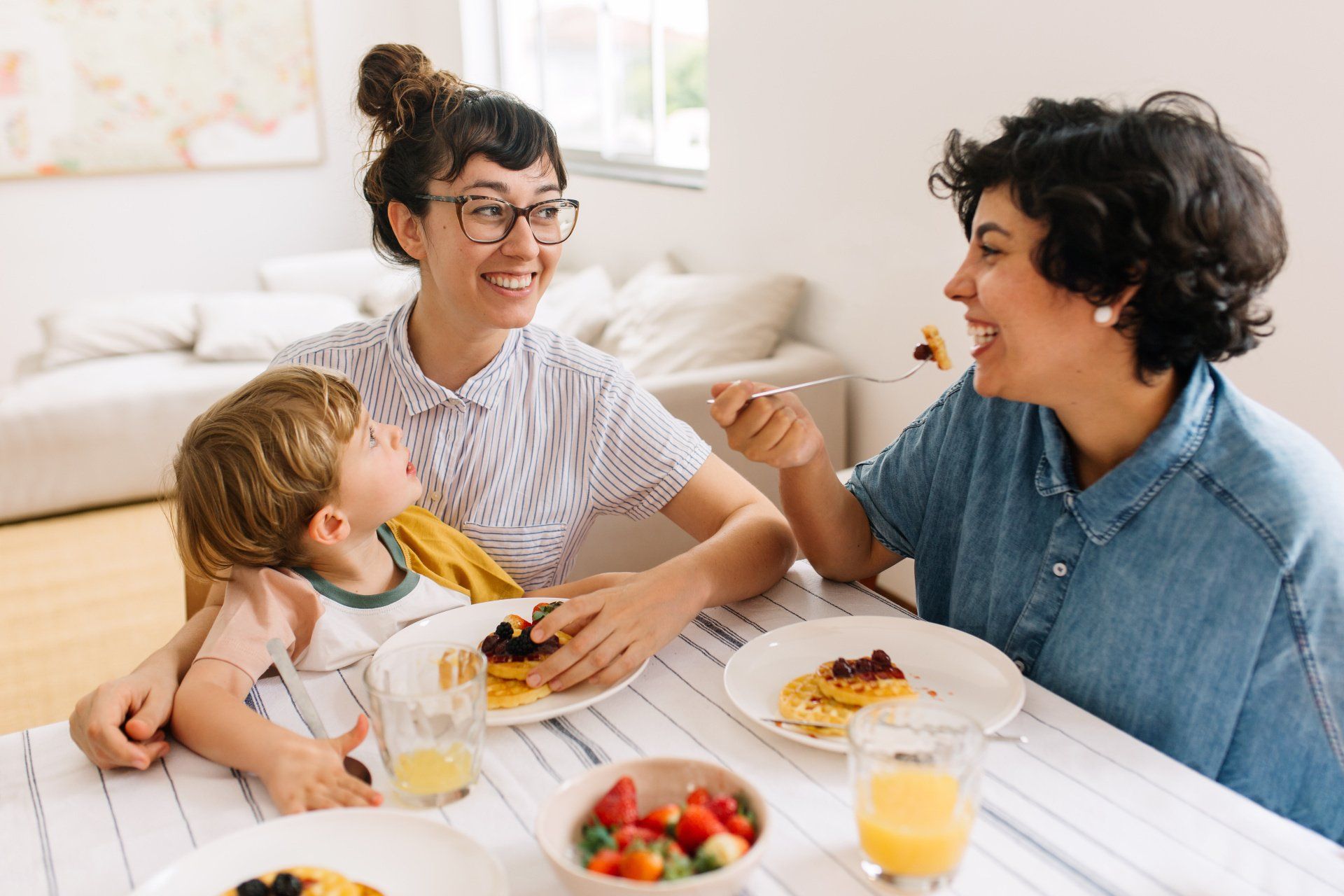 Family sitting at breakfast together