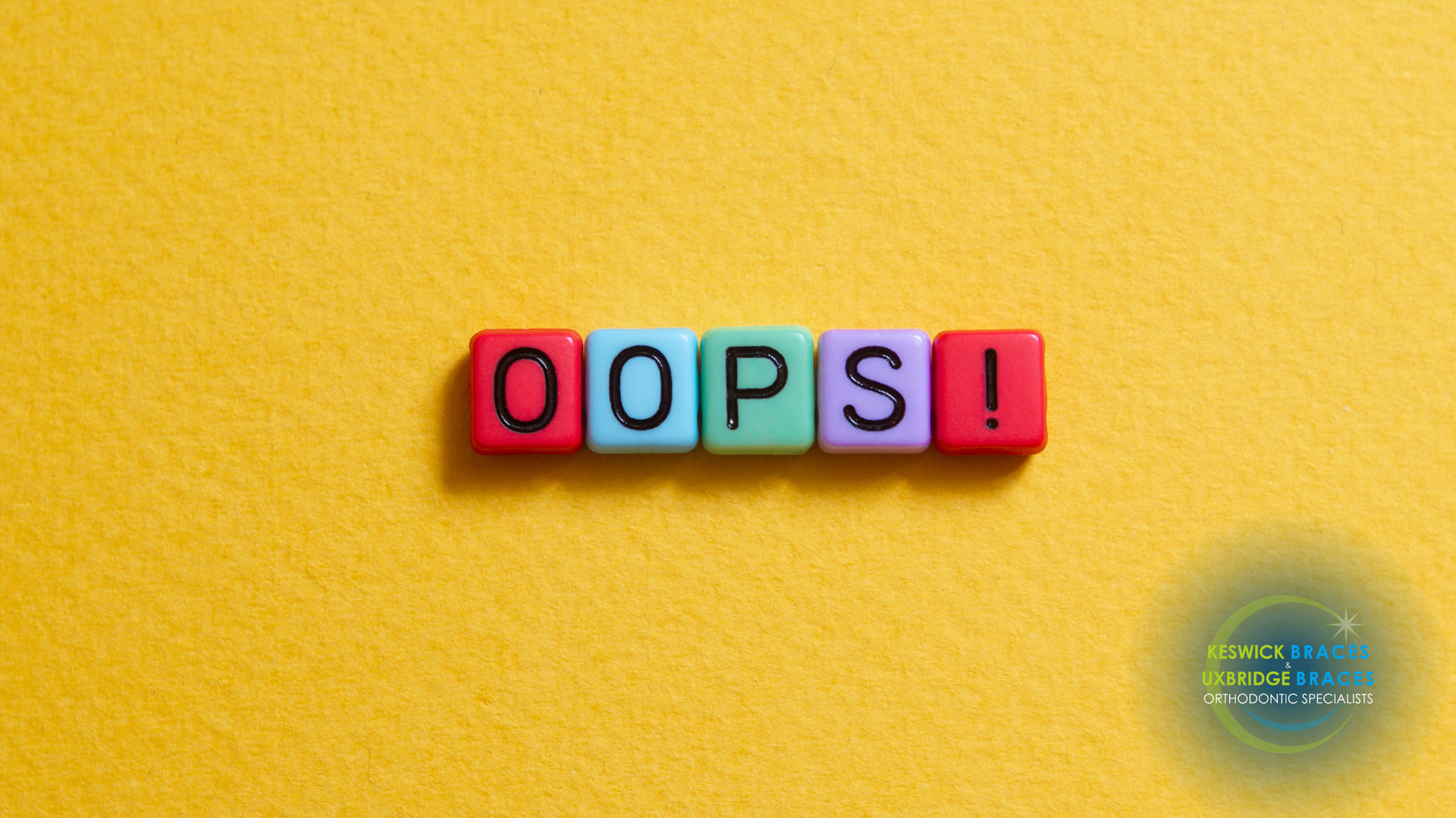 The word oops is written in colorful blocks on a yellow background.