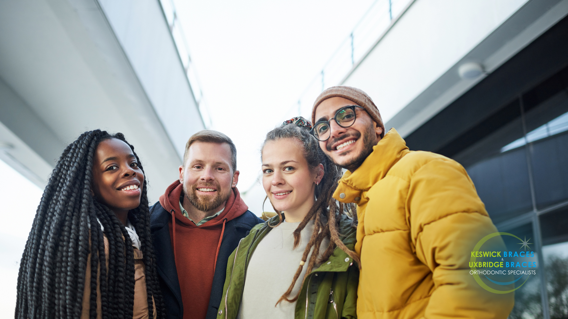 A group of young people are posing for a picture together.