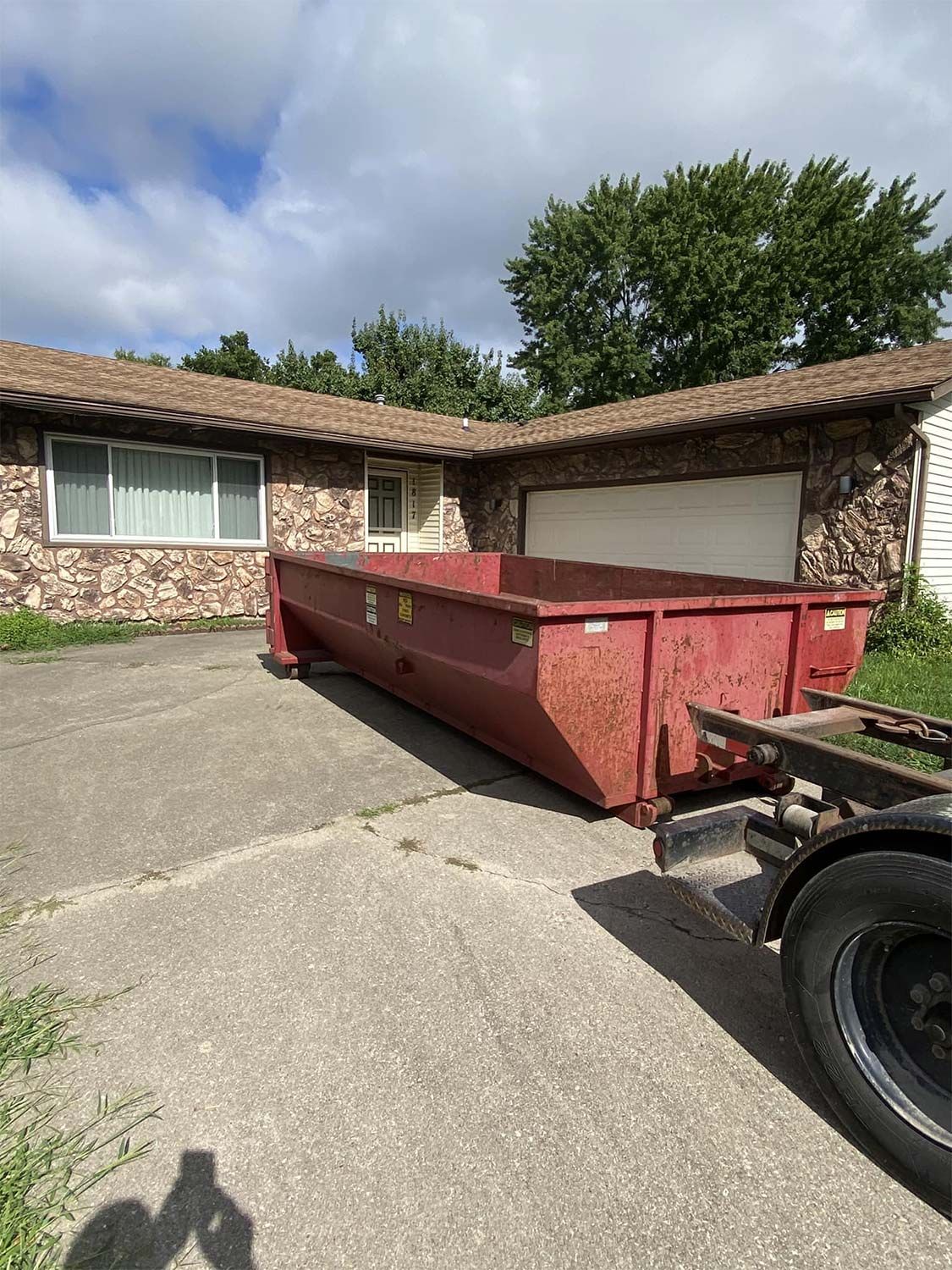 Dumpster on Residential Backyard — Urbana, IL — Redline Disposal LLC