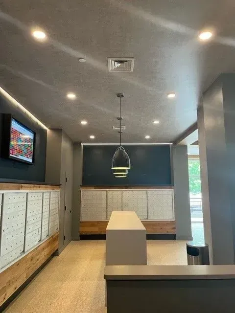 A large room with a tv on the wall