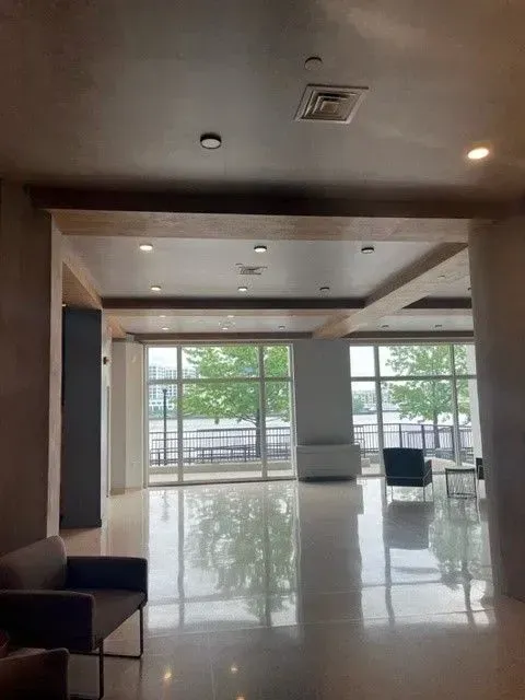 A large room with a lot of windows and chairs