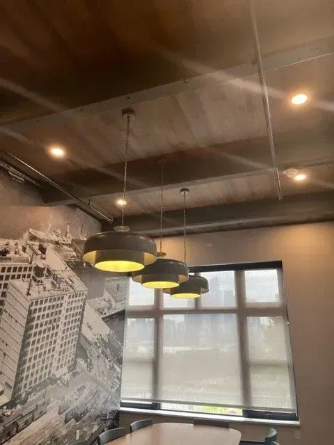 A room with a ceiling that has a picture of a building on it