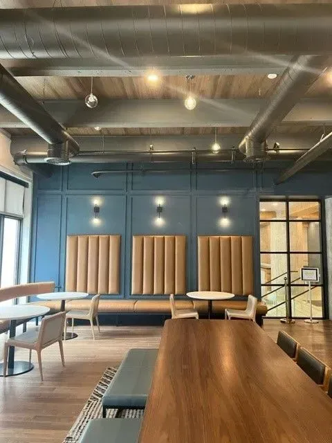 A large room with tables and chairs in it