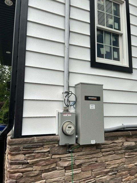 There is a meter on the side of a house.