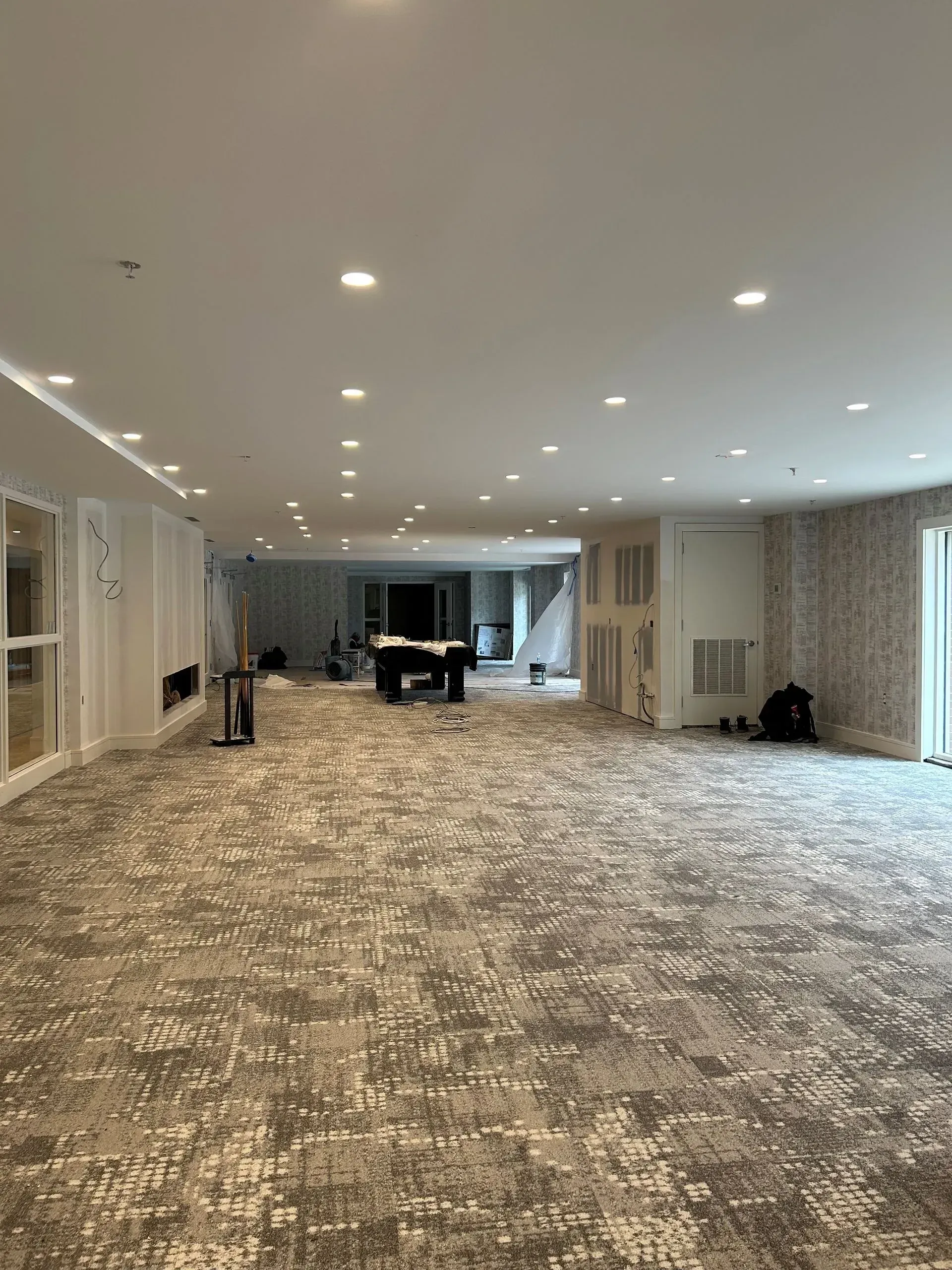 There is a pool table in the middle of the room.