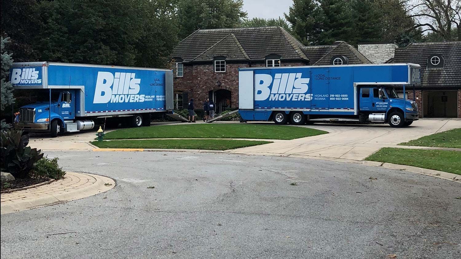 Two Trucks on Residential Area — Highland, IN — Bill's Movers & U-Lock Storage