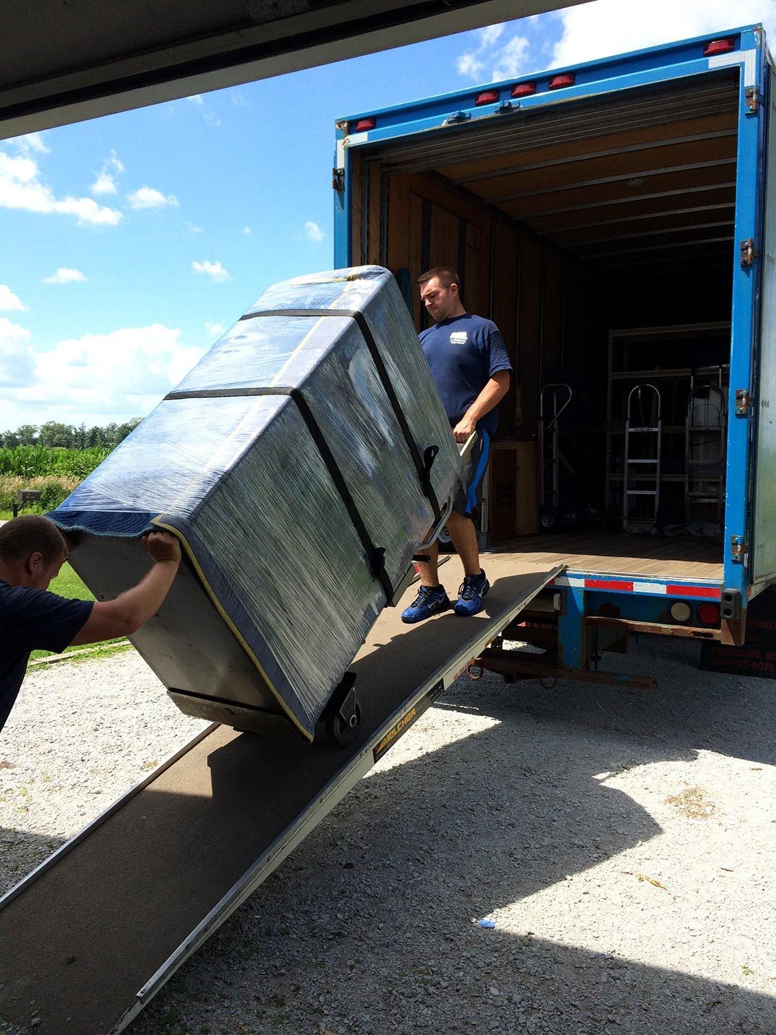 Carrying the Furniture on Truck — Highland, IN — Bill's Movers & U-Lock Storage