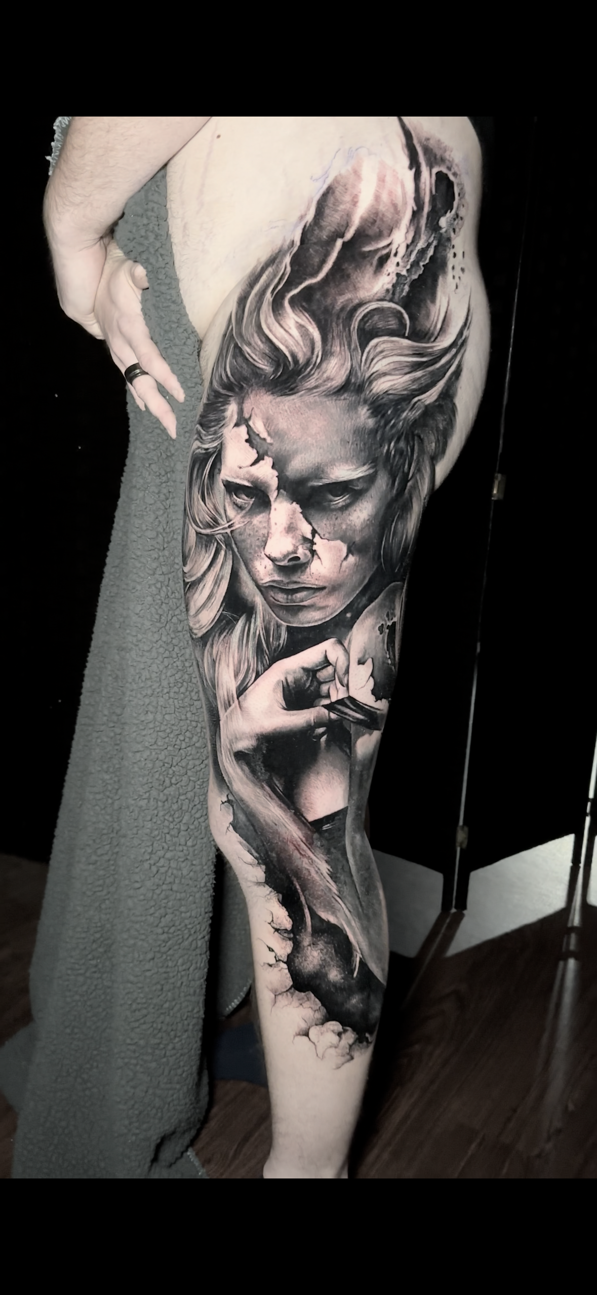 Black and grey tattoo on a thg of  dreamy woman