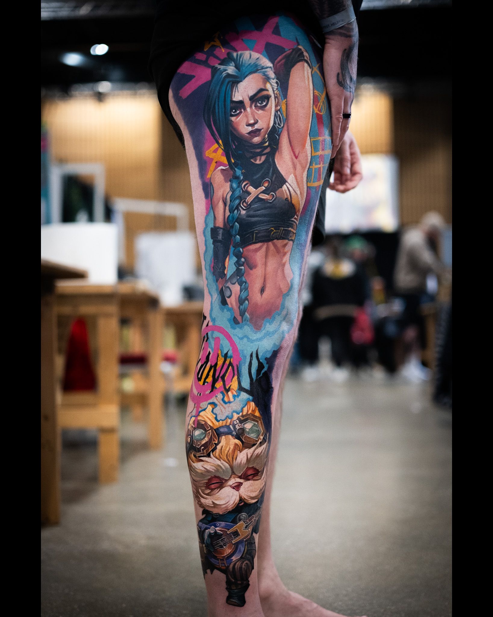 Colourful leg sleeve tattoo of Arcane Jinx