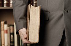 person holding large book