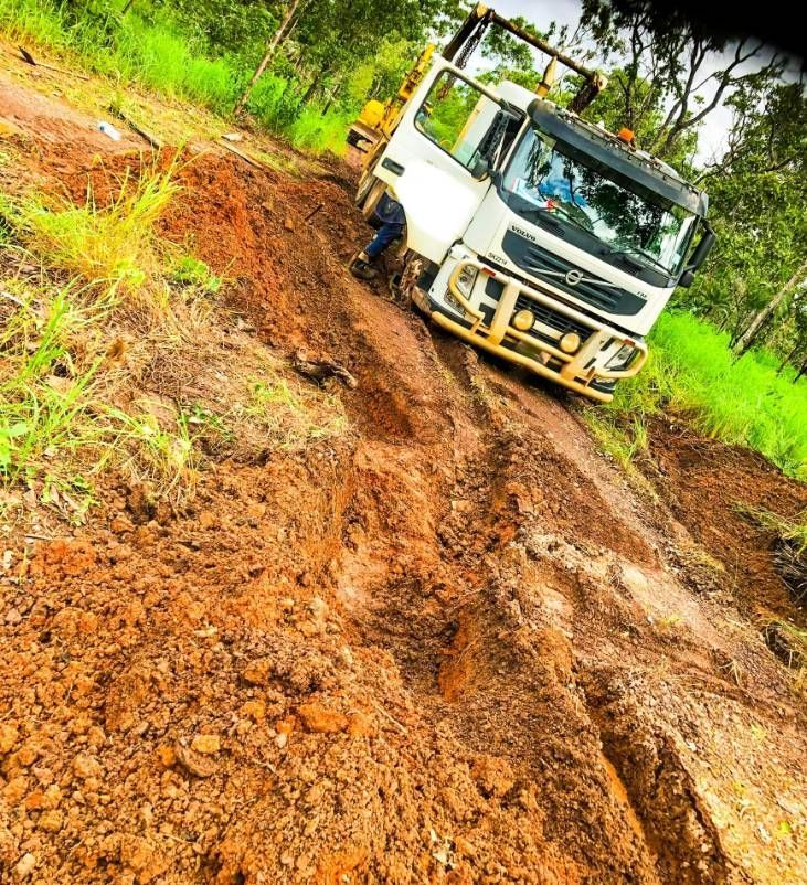 A Truck Is Driving Down A Muddy Road — Fewmore Contracting in Yarrawonga, NT