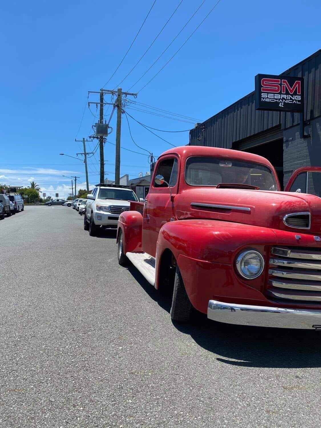 A Red Truck Is Parked On The Side Of The Road β Sebring All Mechanical Repairs In Mermaid Beach, QLD