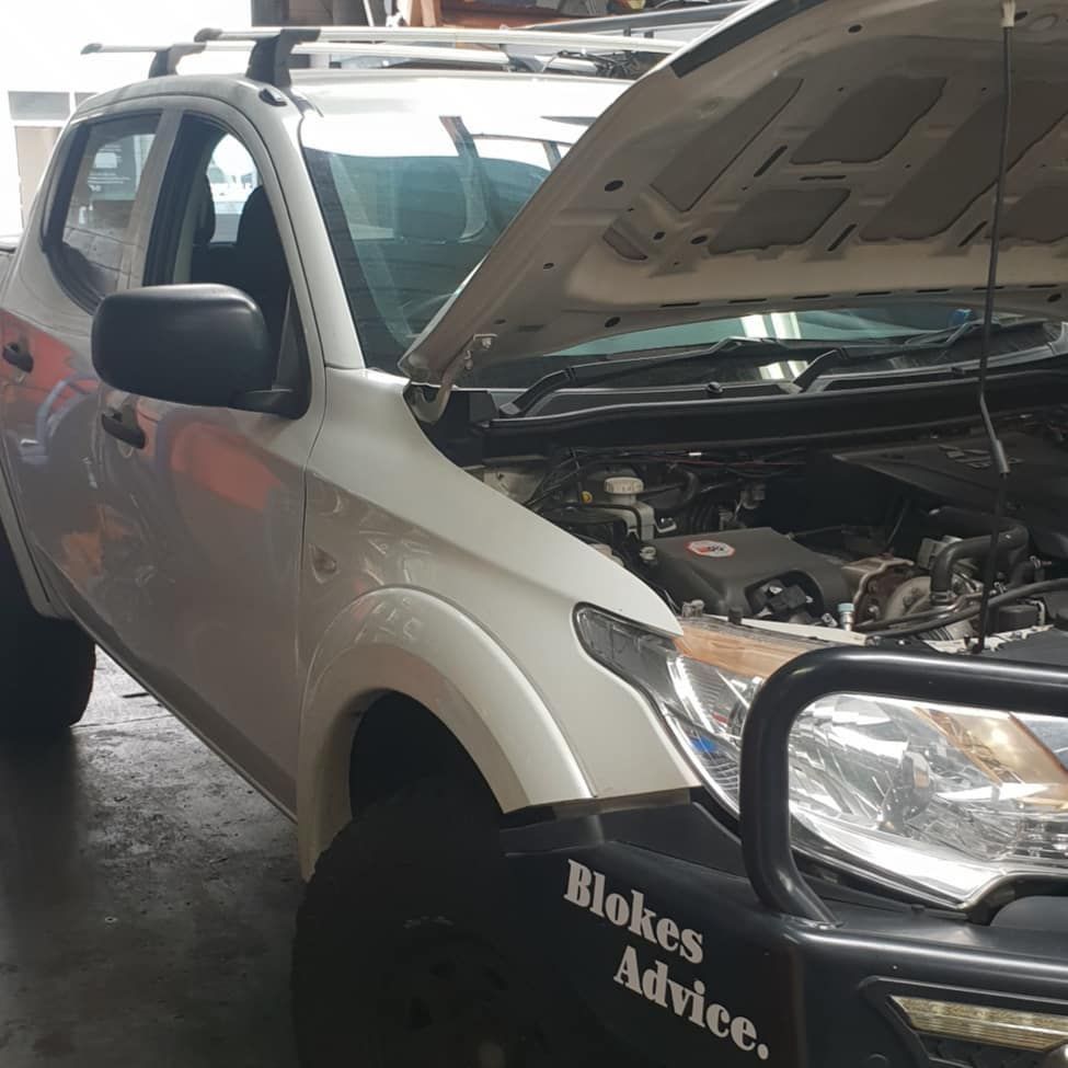 A white truck with the hood open has a sticker on the front that says blokes advice — Sebring All Mechanical Repairs In Mermaid Beach, QLD