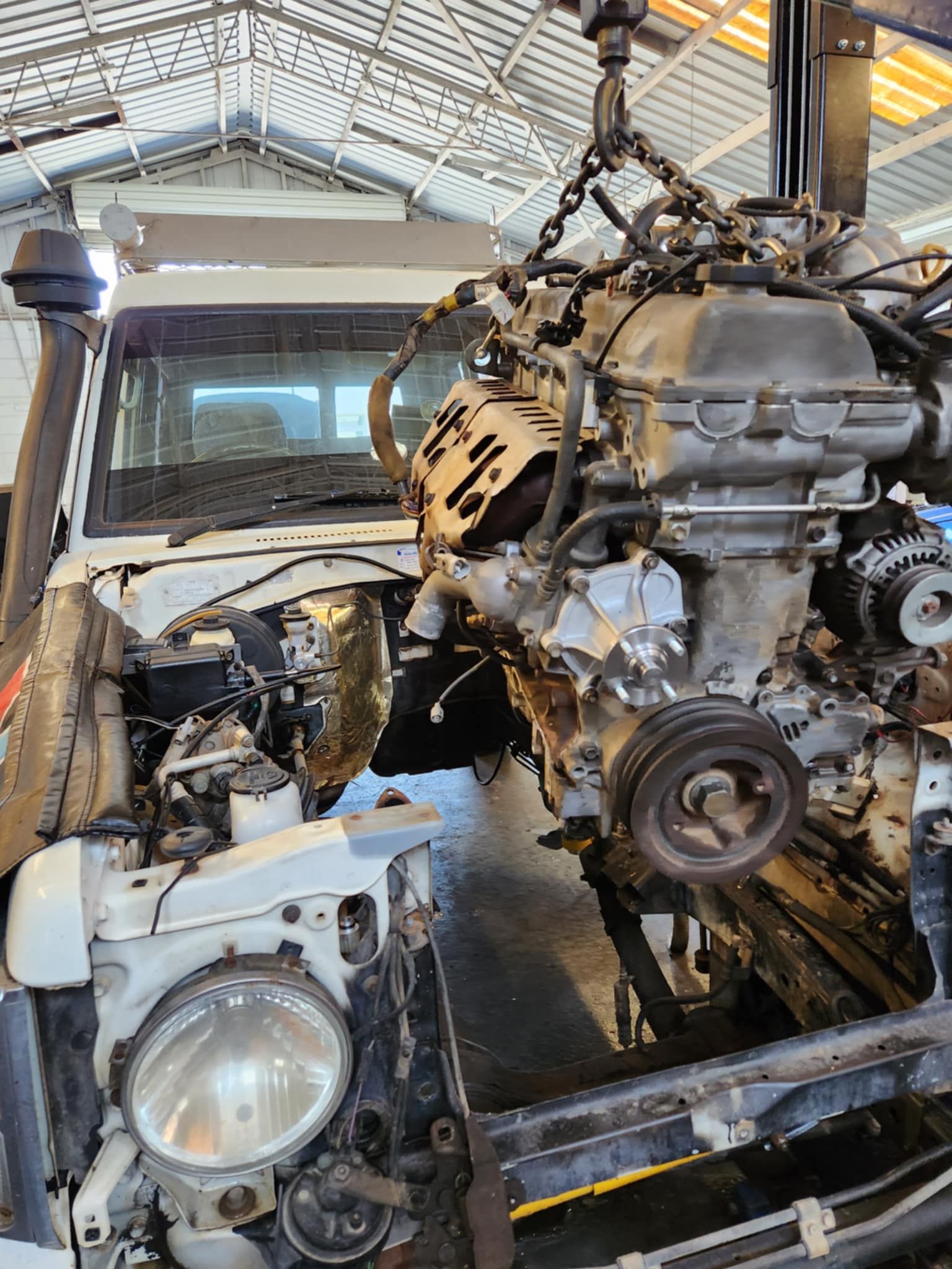 Car Engine Lifted Above A Car  — Sebring All Mechanical Repairs In Mermaid Beach, QLD